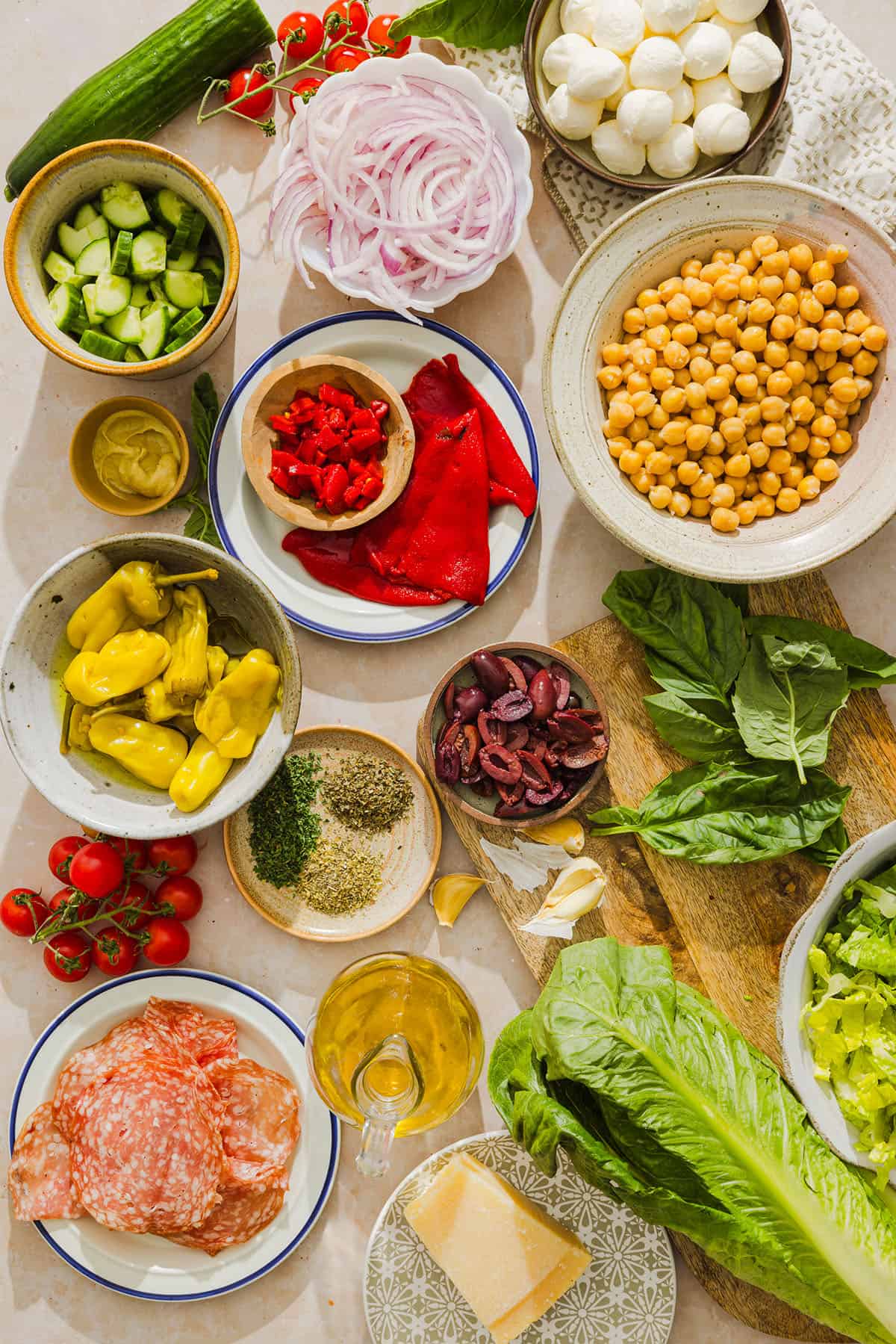This Italian Chopped Salad tastes just like your favorite grinder, but lighter and SO good! Loaded with crisp lettuce, savory salami, chickpeas, fresh veggies and the best homemade dressing, all chopped up so you get the perfect bite every time!